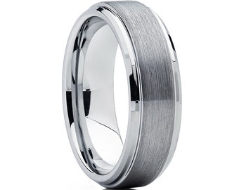 May include: A brushed silver tungsten carbide wedding band with a beveled edge.