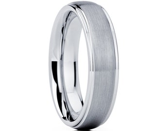 May include: A silver wedding band with a brushed finish and a polished edge.