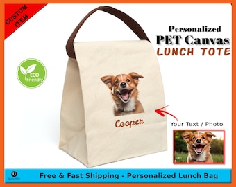 May include: Personalized canvas lunch tote bag with a brown handle. The bag features a photo of a dog with the name "Cooper" printed on it. The bag is customizable with your own text or photo.