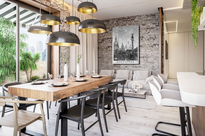 May include: A modern dining room with a wooden table and black chairs. The room has a brick wall with a black and white cityscape print that says "Barcelona". There are several gold and black pendant lights hanging from the ceiling.