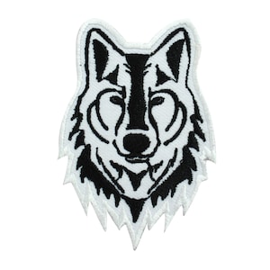 May include: Black and white embroidered iron-on patch of a wolf's head.