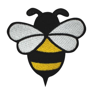 May include: Embroidered bee patch featuring a black body with yellow stripes and white wings. The bee has a pointed stinger and two antennae. This patch is suitable for jackets, bags, or other fabric items.
