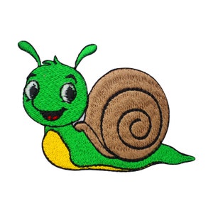May include: An embroidered iron-on patch of a cartoon snail with a smiling face and big eyes, in green and brown.