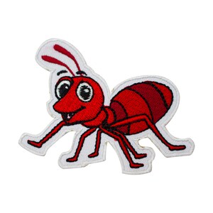 May include: Red cartoon ant with white outline and big eyes. The ant is embroidered on a white fabric.