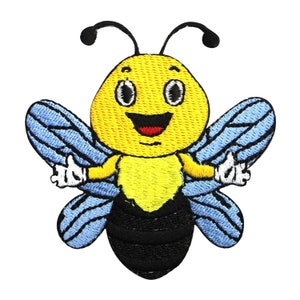 May include: A yellow and black embroidered bee with a smiling face and blue wings. The bee is holding its arms up in a thumbs up gesture.