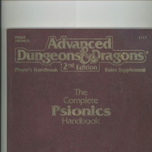 May include: A burgundy book cover with gold lettering. The title is "Advanced Dungeons & Dragons" with the subtitle "The Complete Psionics Handbook".