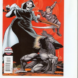 May include: Grayson #17 comic book cover featuring a skeletal figure, a man with a gun, and Batman in action against a red background. The cover art is by Neal Adams. The comic is rated T for Teen.