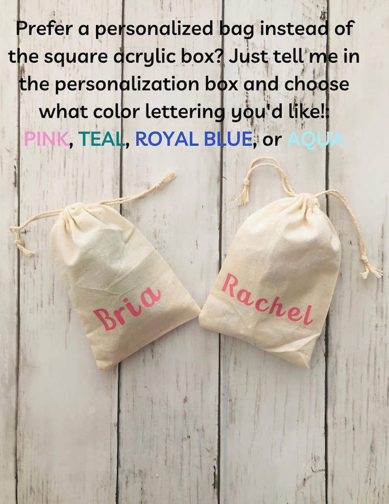May include: Two white cotton drawstring bags with pink lettering. The bag on the left says "Bria" and the bag on the right says "Rachel".