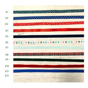 May include: Twelve different ribbon options for gift wrapping. The ribbons are in various colors and patterns, including green, blue, red, white, and black. The ribbons are numbered 1 through 12.