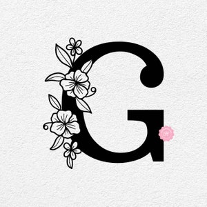 K&ouml;nnte beinhalten: Schwarz-wei&szlig;es Blumenmuster mit dem Buchstaben G mit stilisierten Blumen und Bl&auml;ttern.