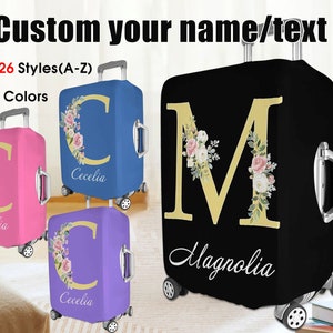 May include: Four luggage covers with floral designs and personalized initials. The covers are in pink, blue, purple, and black. The covers feature the letters C and M with floral designs and the names Cecelia and Magnolia.