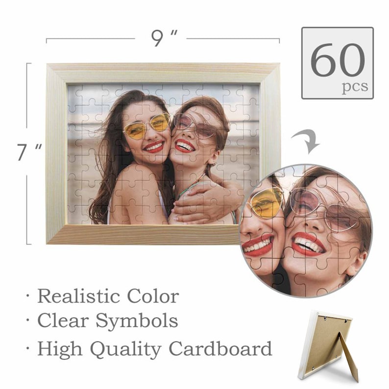 May include: A 60-piece jigsaw puzzle in a wooden frame with a picture of two women smiling and wearing sunglasses. The puzzle is 7 inches by 9 inches.