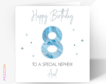 May include: A white card with blue and gold marbled number 8, the text "Happy Birthday" and "To a special nephew Axel".