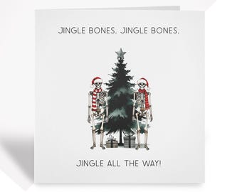 May include: A Christmas card featuring two skeletons wearing Santa hats standing in front of a Christmas tree with the text "Jingle Bones, Jingle Bones, Jingle All The Way!"