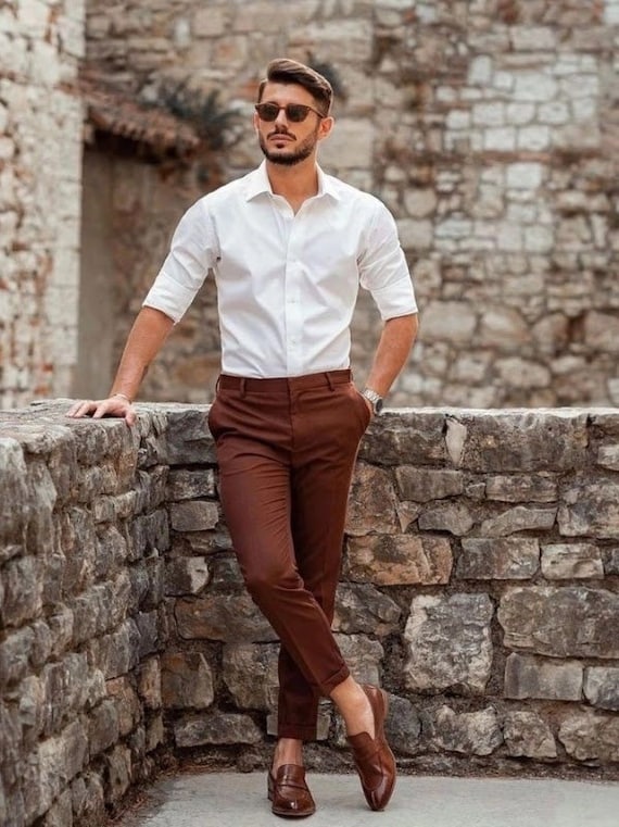 Man in white dress shirt and brown pants sitting on brown grass during  daytime photo – Free Clothing Image on Unsplash