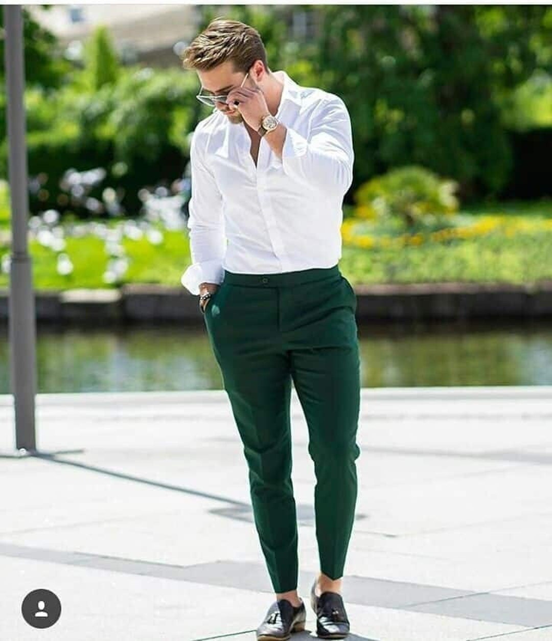 man with an orange t-shirt and green pants Stock Photo - Alamy