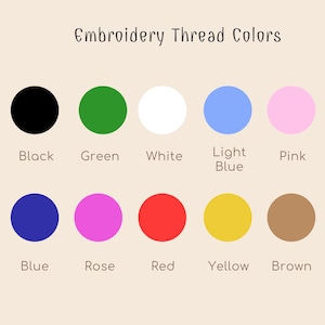 May include: A chart showing 10 different embroidery thread colors. The colors are black, green, white, light blue, pink, blue, rose, red, yellow, and brown.