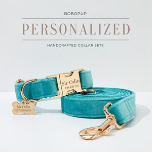 May include: A turquoise blue velvet dog collar and leash set with gold hardware. The collar has a personalized name tag that reads "Sir Odin 08-06-24". The leash has a matching tag with the name and a phone number.