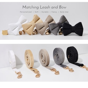 May include: Matching dog leash and bow sets in white, tan, gray, and black. Each bow tie has a gold-colored bell and clasp. The leashes are rolled up, with gold-colored clasps.