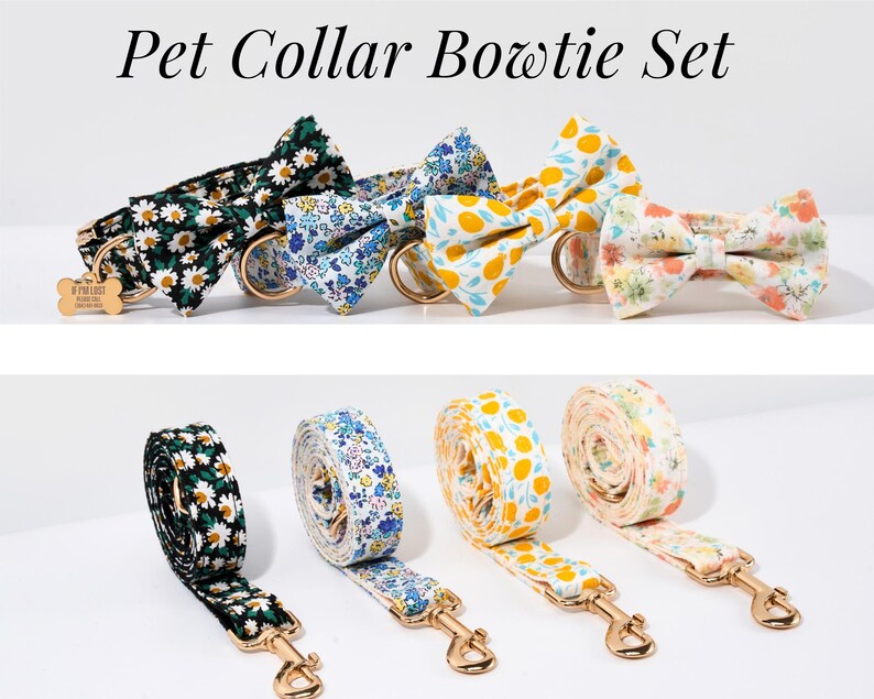 May include: Pet Collar Bowtie Set. The image displays a set of pet collars and matching bowties in various floral and fruit patterns. The collars have gold-colored hardware and a small tag. The matching leashes are rolled up and feature the same patterns.