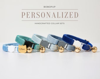 May include: Five colorful cat collars with bells and a personalized name tag. The collars are made of velvet and come in shades of blue, green, and teal. The name tag says "Oliver".