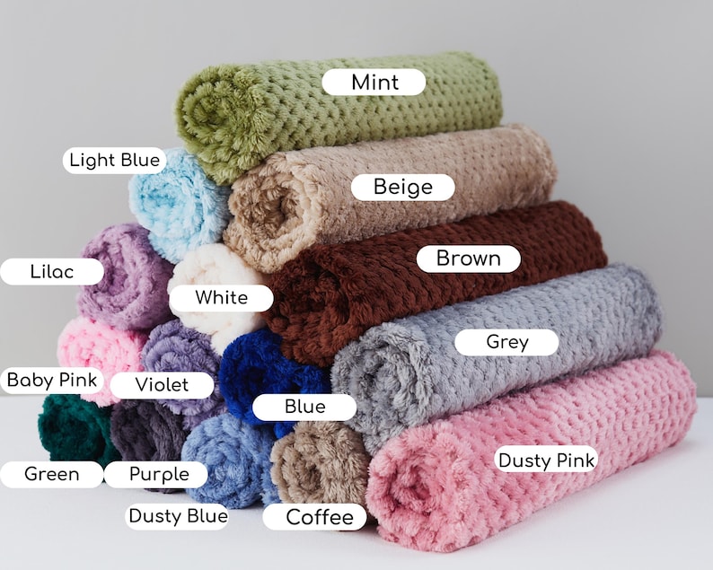 May include: A stack of 12 plush blankets in various colors, including mint, beige, brown, grey, dusty pink, coffee, light blue, lilac, white, baby pink, violet, blue, green, purple, and dusty blue.
