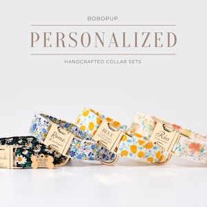 May include: Four personalized dog collar sets with floral patterns and gold-colored hardware. The collars feature names like "Cadi", "Rome", "Blue", and "Rio". The text "PERSONALIZED HANDCRAFTED COLLAR SETS" is displayed above the collars.