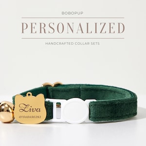 May include: A green velvet cat collar with a gold cat-shaped tag engraved with the name "Ziva" and a phone number. The collar has a white plastic buckle and a gold bell.