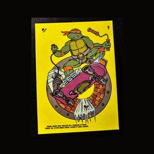 Michelangelo Power Skateboard* Teenage Mutant Ninja Turtles (1989) Sticker W/Toploader, kostenloser Versand!