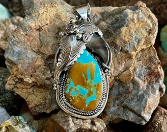 Sterling Pendant with Blue Royston Turquoise and Claw Accent