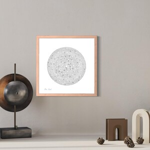 May include: A square framed wall art piece featuring a black and white circular maze design on a white background. The frame is a light wood tone. The maze consists of concentric rings with a clear start and end point, centred within the frame.