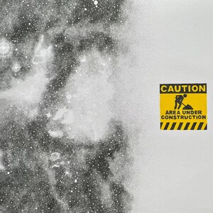 May include: A black and white stippled illustration of a nebula or galaxy on the left side, transitioning into a plain white background on the right. A yellow and black square sign features the text CAUTION AREA UNDER CONSTRUCTION with a graphic.