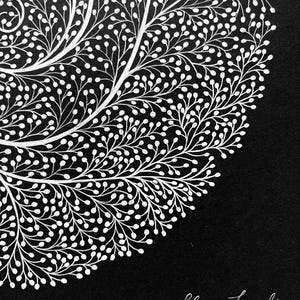 May include: A black and white illustration featuring a dense, intricate pattern of white branching lines with small circular buds on a solid black background. The artwork includes the signature Juliana Favorschi in white script in the bottom corner.