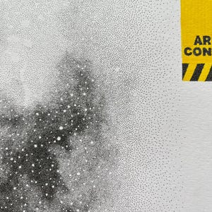 May include: A black and white stippled art print featuring a dense cluster of dots creating a dark, nebulous shape against a white background. In the upper right corner, a yellow rectangular caution label displays the text CAUTION AREA CONSTRUCT.