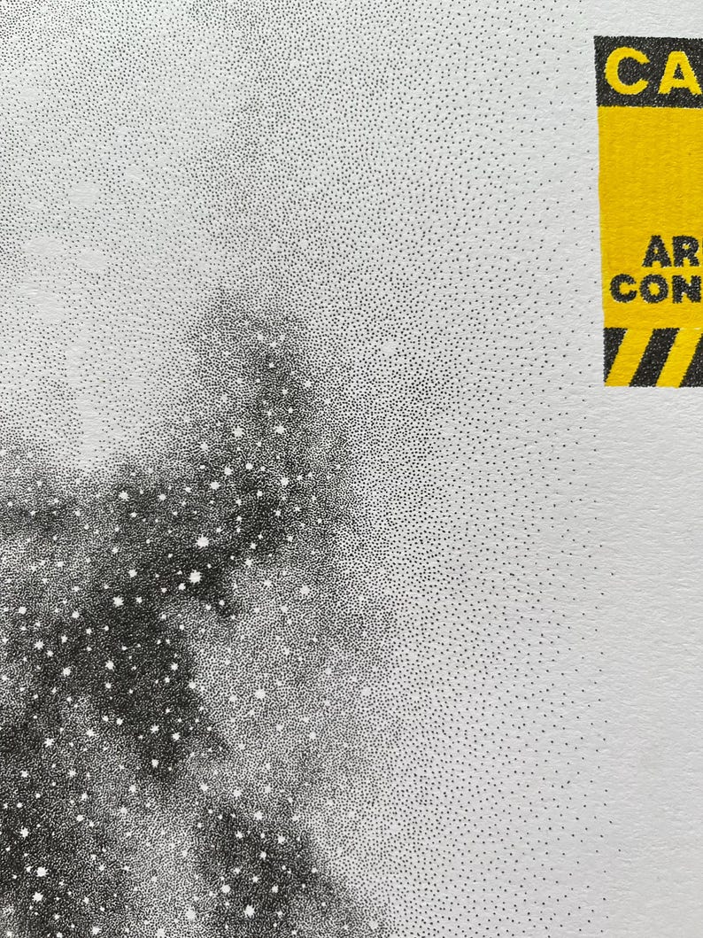May include: A black and white stippled art print featuring a dense cluster of dots creating a dark, nebulous shape against a white background. In the upper right corner, a yellow rectangular caution label displays the text CAUTION AREA CONSTRUCT.