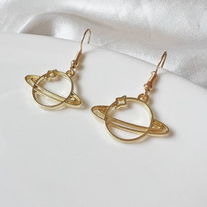 Gold Saturn stud/ clip on Earrings