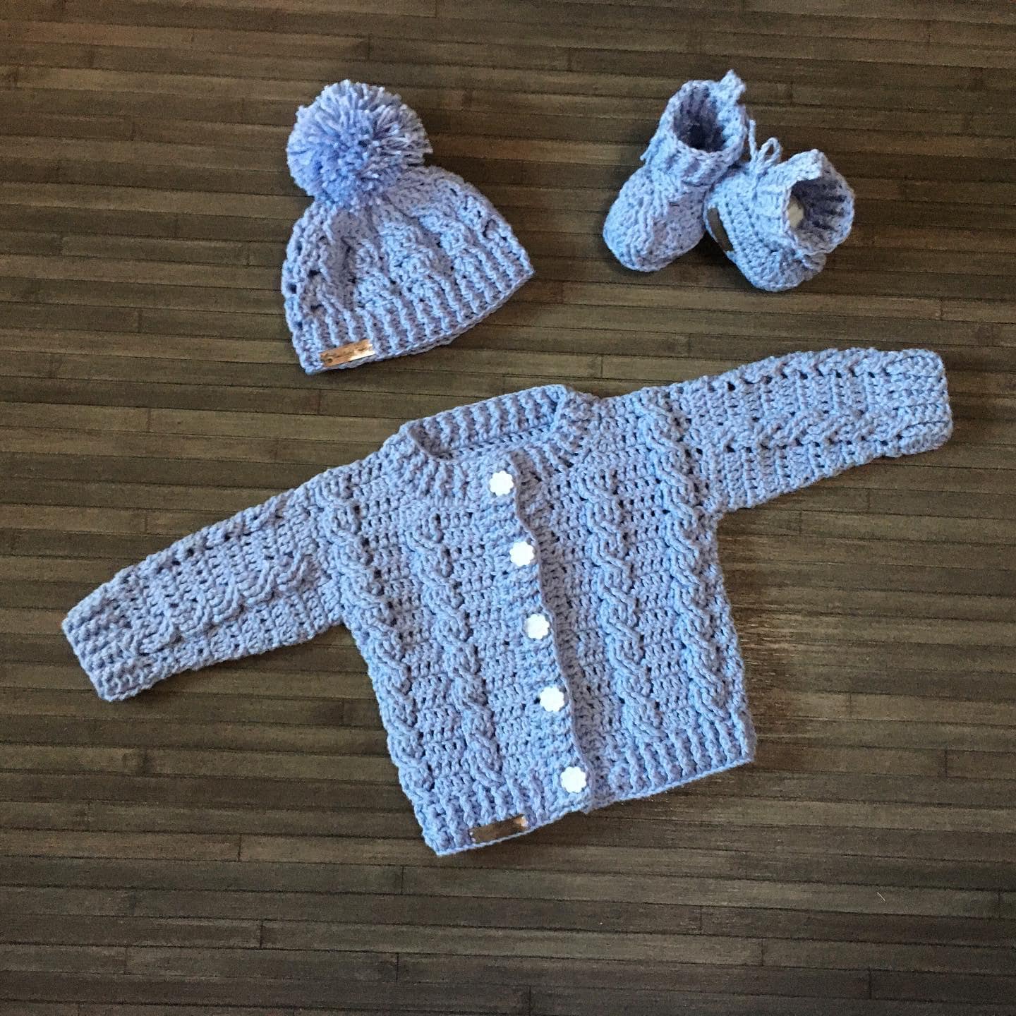 24 Stylish Crochet Clothing Patterns You’ll Want to Make for Babies, Dolls, and Wearables 8 Crochet Baby Cardigan Hat Booties Set