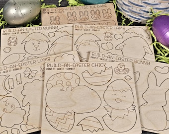 May include: A set of six unfinished wooden Easter craft kits. The kits include a tic-tac-toe game, a bunny, a lamb, a chick, and two more bunnies. Each kit has the words "Build-an-Easter" and the name of the animal or game. The kits are ready to be painted and assembled.