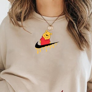 Nike pooh bear sweatshirt clearance