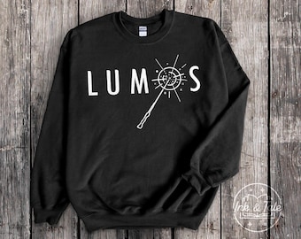 Lumos Crewneck Sweatshirt | Magical Spell Graphic Print Sweater | Unisex Wizarding Wand Slogan Fashion Streetwear