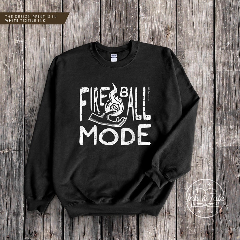 May include: Black sweatshirt with a white graphic print that says "Fireball Mode" with a stylized image of a hand holding a flaming dice.