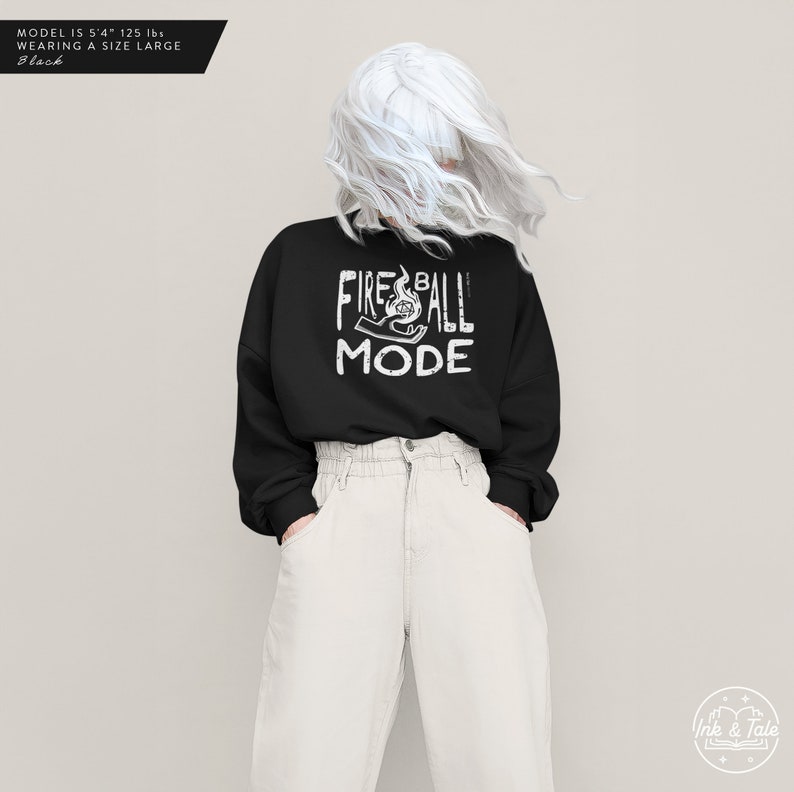 May include: Black sweatshirt with white text that reads "Fireball Mode" and a graphic of a hand holding a fireball.