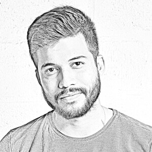 May include: A black and white sketch of a man with short, styled hair and a beard. He is wearing a plain, dark grey t-shirt.
