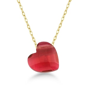 May include: A gold chain necklace with a red heart-shaped pendant.