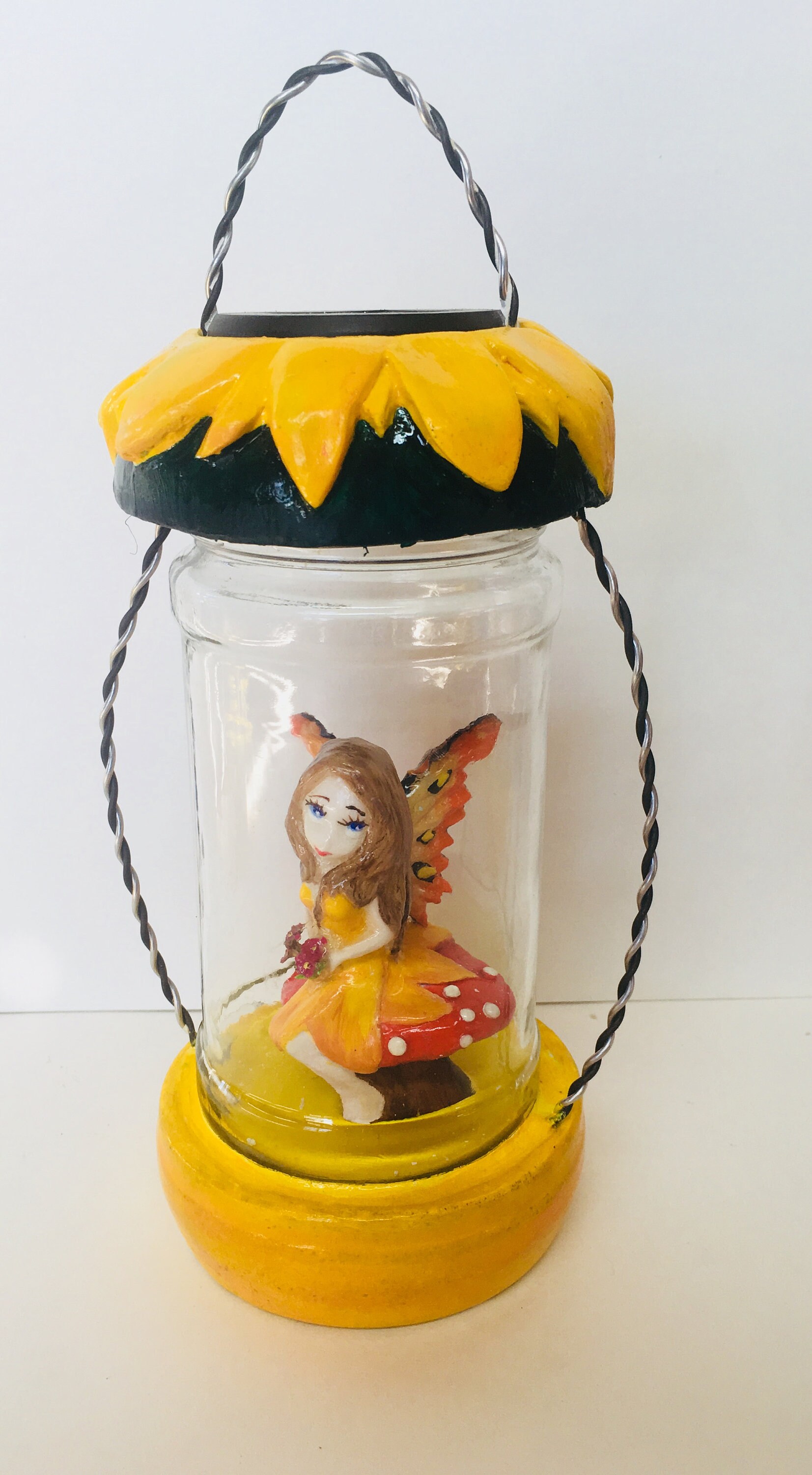 fairy with lantern statue