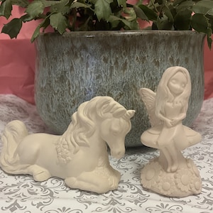 beautiful unicorn and fairy with flowers