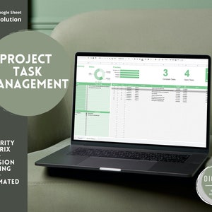 May include: A laptop computer displaying a Google Sheet spreadsheet with the title "Project Task Management". The spreadsheet includes a priority matrix, decision making, and automated features. The laptop is on a green sofa with a green and white "Digital Sideline Solutions" logo in the bottom right corner.