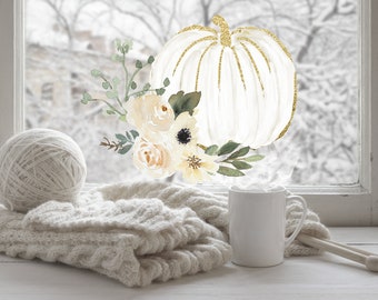 Puede incluir: Ilustración en acuarela de una calabaza blanca con detalles dorados, rodeada de elementos florales. Una madeja de lana, una manta de punto y una taza blanca con vapor crean un ambiente otoñal y acogedor en un alféizar.