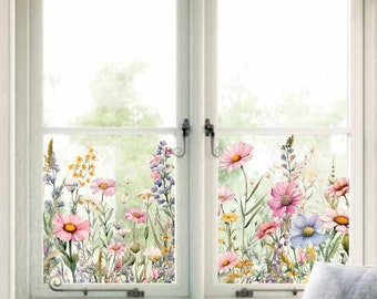 May include: A window with a floral design on the glass. The design features pink, purple, and yellow flowers with green leaves. The window is framed in white.