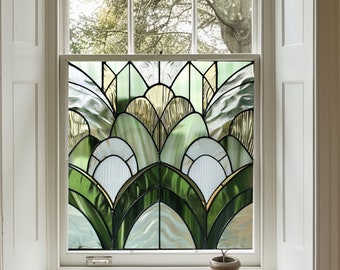 May include: A stained glass window with a geometric design featuring green, white, and gold hues. The window is set in a white frame and is surrounded by white trim.